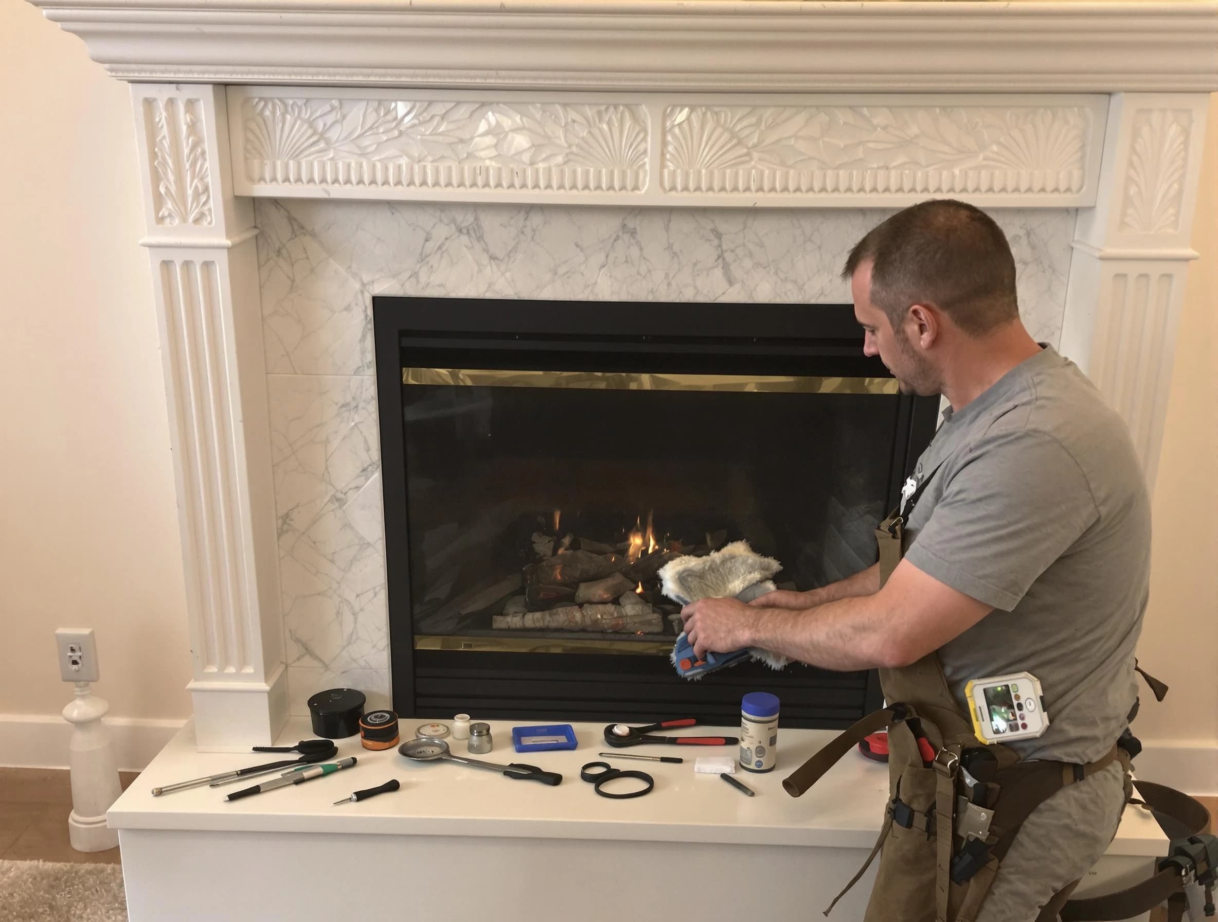 Wakefield Chimney Sweep performing fireplace maintenance in Wakefield, MA