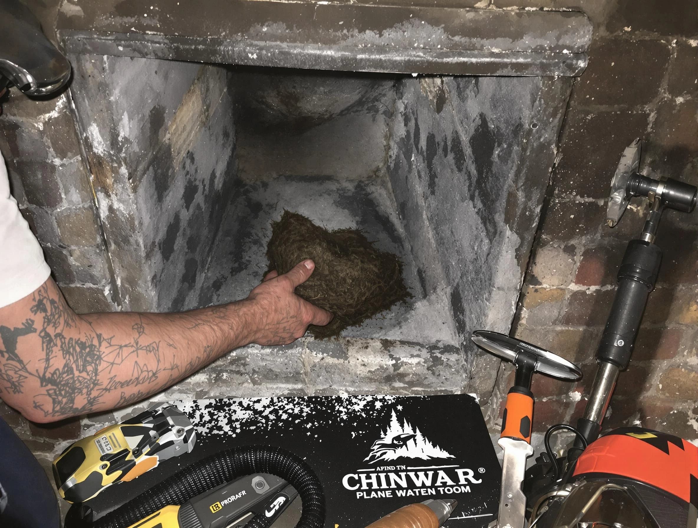 Wakefield Chimney Sweep safely removing debris and screening chimney in Wakefield, MA